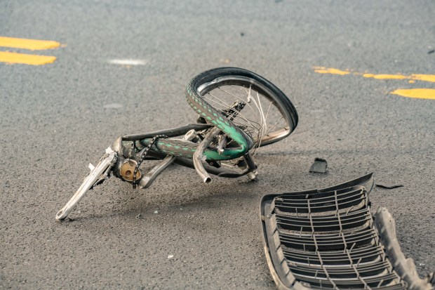 A man on a bicycle who was reportedly breaking into cars was rushed to hospital in critical condition after a man driving a Jeep Grand Cherokee SUV chased him down and crushed him into two parked cars and a tractor before flipping the SUV on Broadway near Ellery Street in Brooklyn on Monday September 2, 2019. 0740. Reports indicate the driver was promptly arrested. (Theodore Parisienne for New York Daily News)